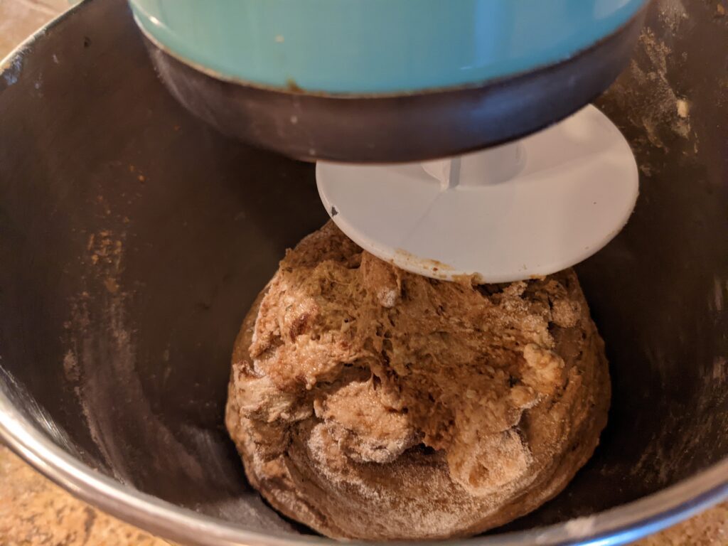 Dough mixed together in a bowl before baking bread

