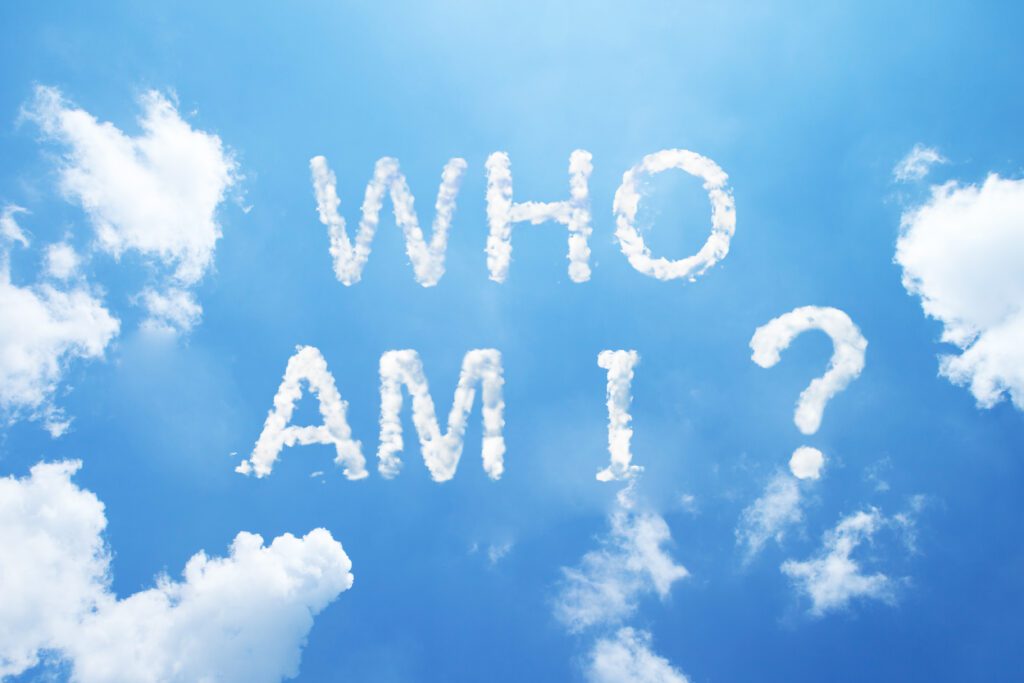 Clouds on blue sky forming words "Who am I?"