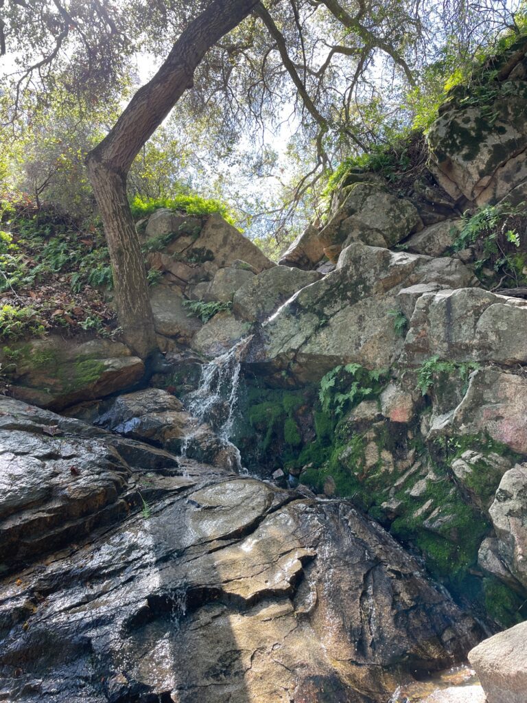 Beautiful waterfall through rocks, seen in nature
